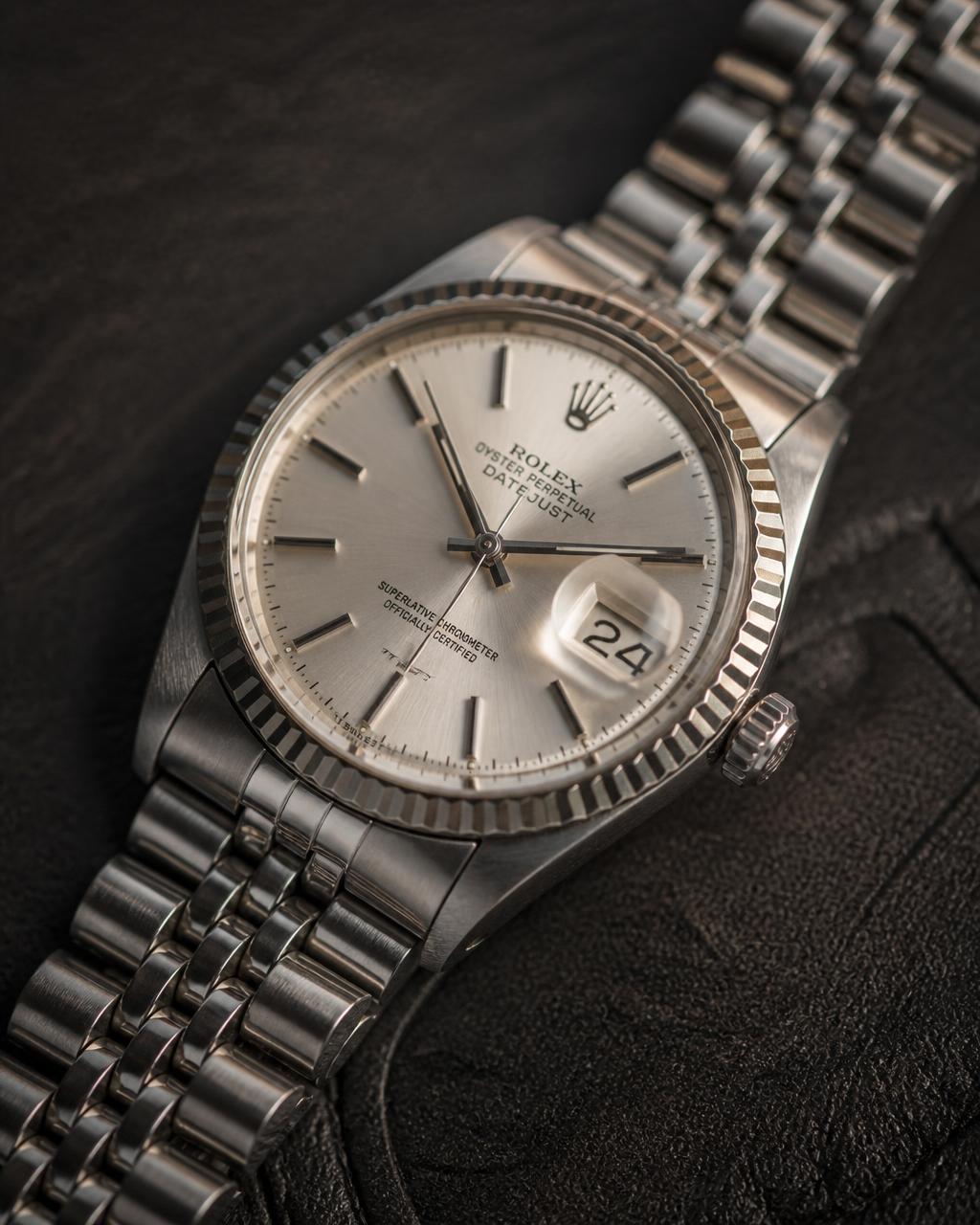 Pre-owned Rolex Datejust with fluted bezel and jubilee bracelet on dark leather